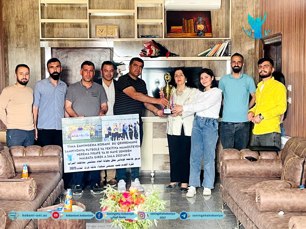 Captain Mohammed Abdi, the Head of Sports Activities, along with several members of the university team that won the Teachers’ Championship in the Euphrates Region, presented the championship trophy to the university